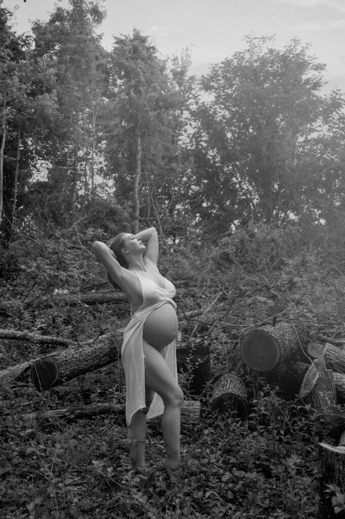 Pregnant poses in woods
