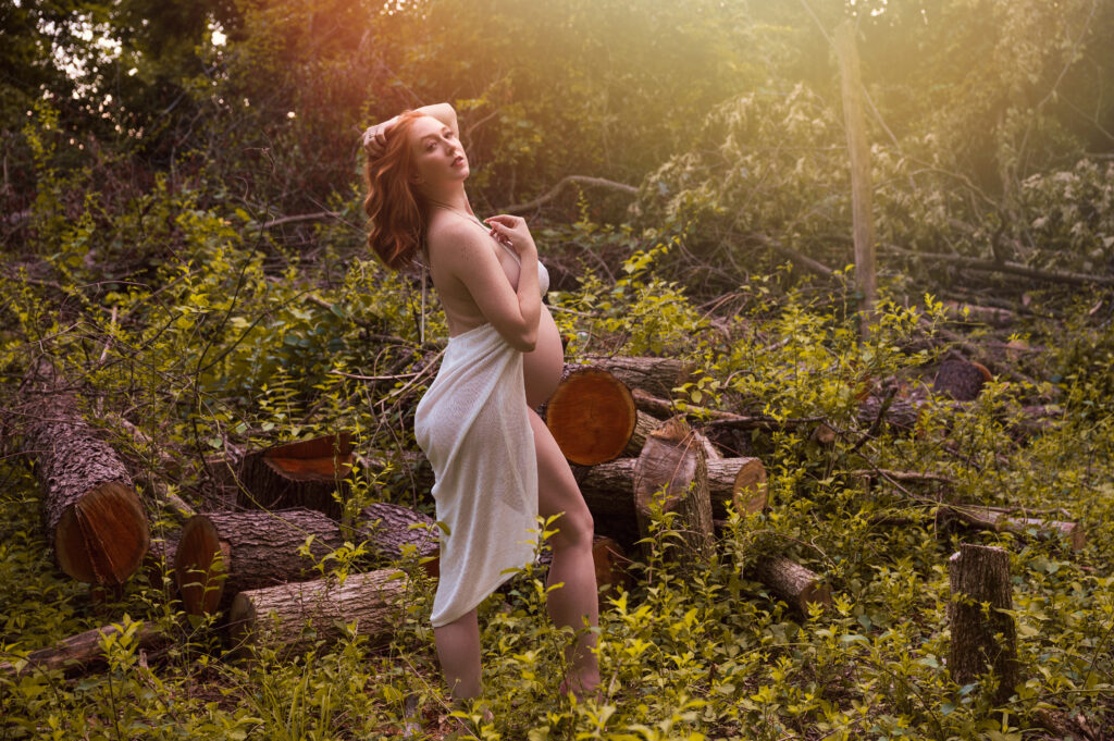woman in woods pregnant
